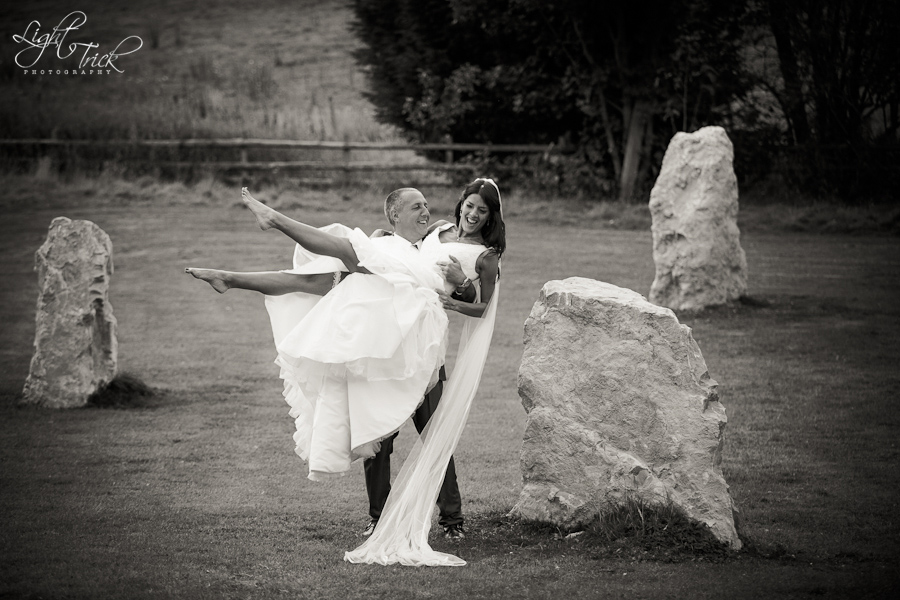 s20120831173422-Edit groom lifting bride in a stone circle